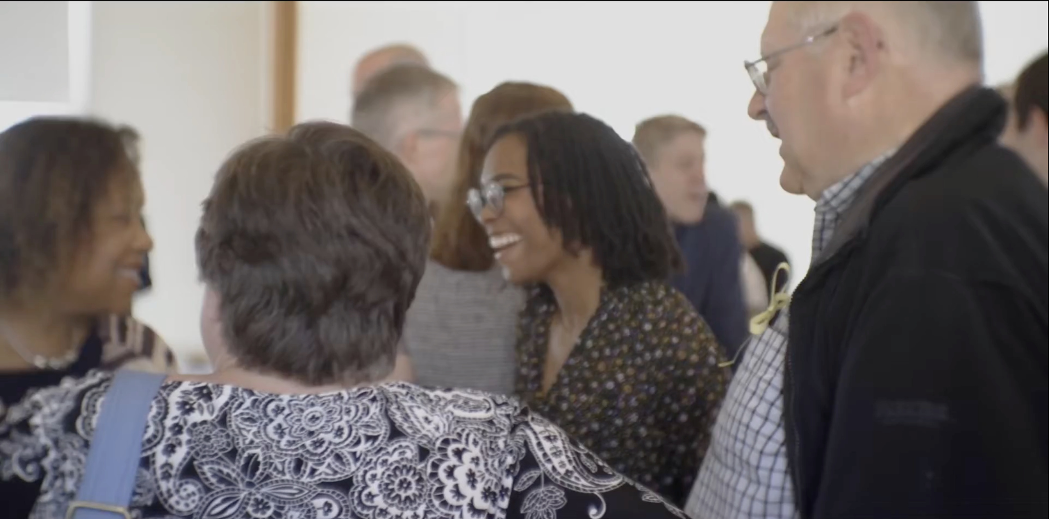 Members of First Presbyterian Church of Fairfield greeting one another warmly